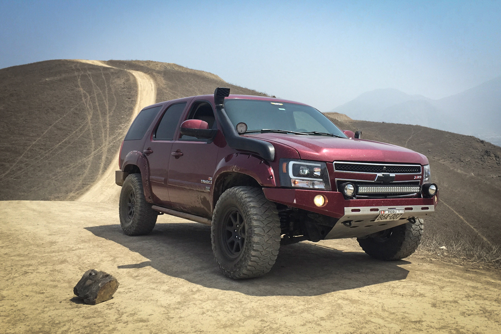 1-01-Maroon-Chevrolet-Tahoe-lift-kit-off-road-tires-snorkle-skidplate