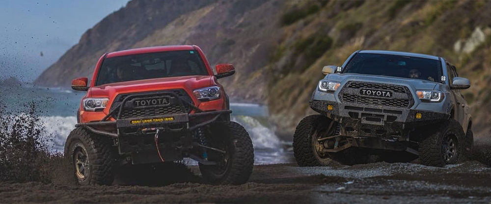 2016 Toyota Tacomas with Total Chaos long travel kits, one with +2 inch and one with +3.5 inch wider suspension for increased wheel travel and terrain control