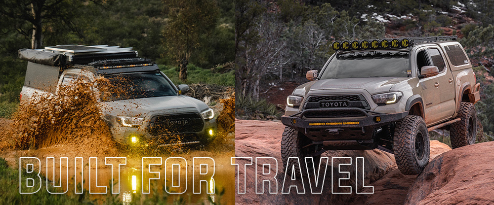 Overland-built Toyota Tacoma with Total Chaos long travel suspension kit, featuring roof rack, gear storage, and extended off-road suspension for remote terrain