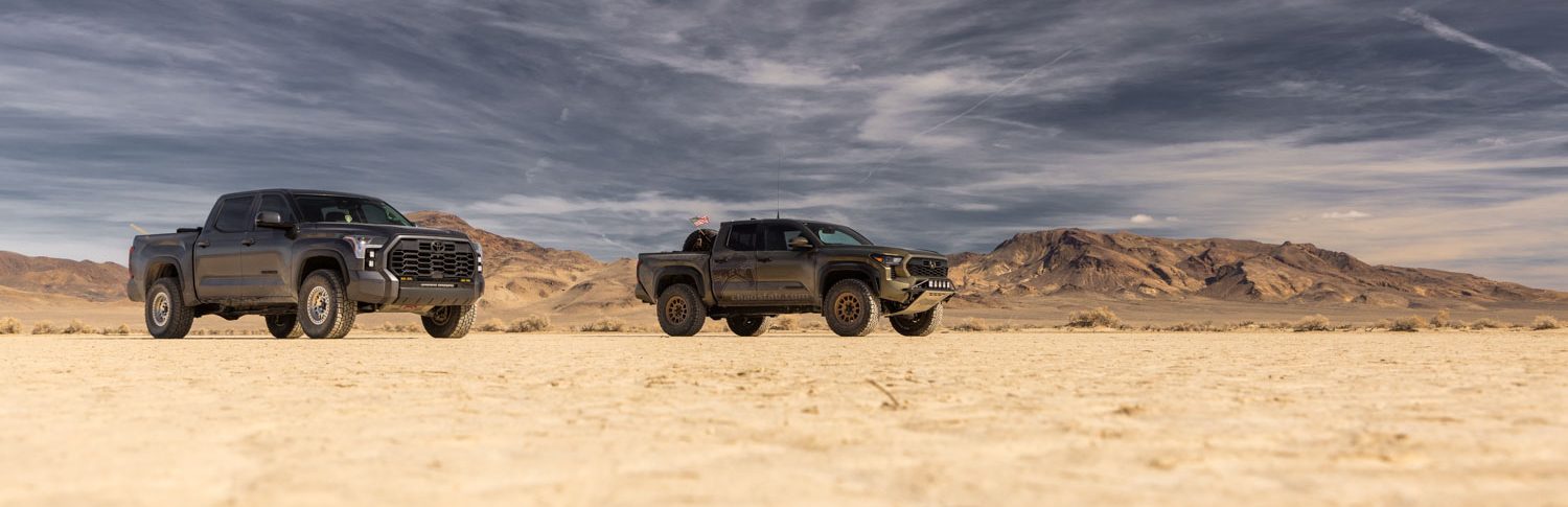 2026 Tacoma posed on a dry lake bed with 35 inch tires and TOTAL CHOAS Suspension